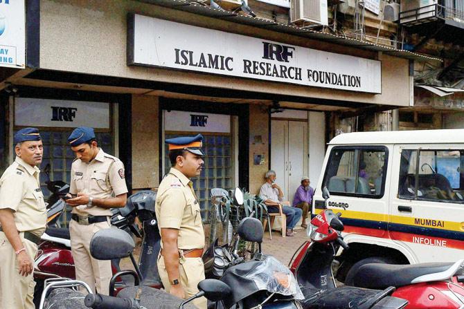 Police outside the Islamic Research Foundation office