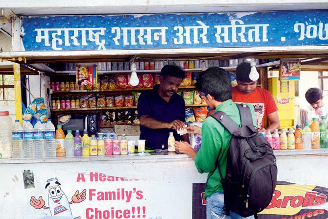 Losing ground: An Aarey booth operator selling dairy products similar to the ones sold by the state-owned dairy. Pic/Satej Shinde