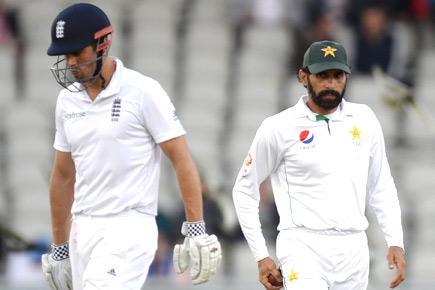 Manchester Test: Rain forces early tea as England on course for win
