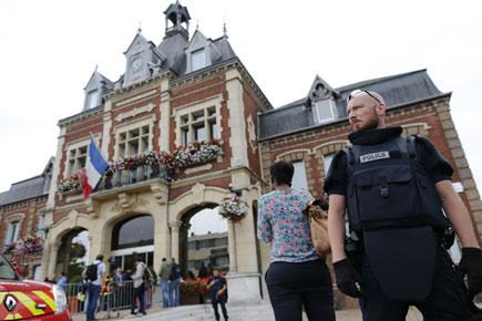 Priest's throat slit in French church hostage taking