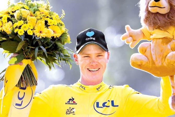 Tour de France winner Christopher Froome celebrates his yellow jersey after the last stage in Paris on Sunday. Pic/AFP