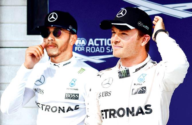 Mercedes drivers Lewis Hamilton (left) and Nico Rosberg after the Hungarian GP on Sunday. Pic/AFP
