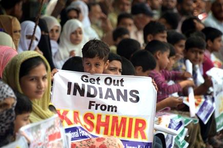 Thousands march in Kashmir's Achabal town to protest arrest of youth