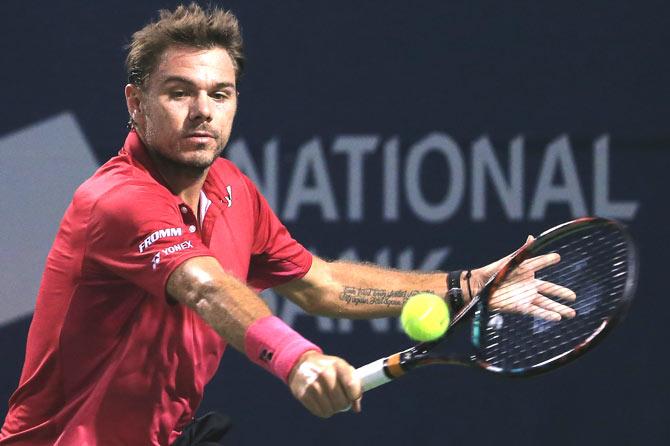 Stan Wawrinka of Switzerland plays a shot against Mikhail Youzhny of Russia during Day 2 of the Rogers Cup at the Aviva Centre on July 26, 2016 in Toronto, Ontario, Canada. Pic/AFP