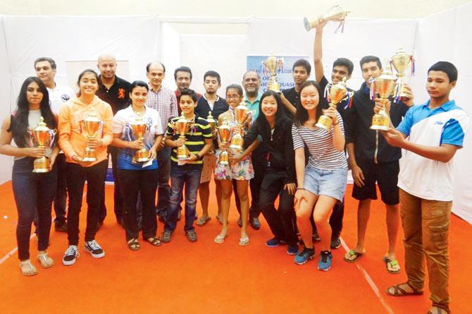 Individual winners of the NSCI Indian Classic Junior Open squash championship pose with their trophies