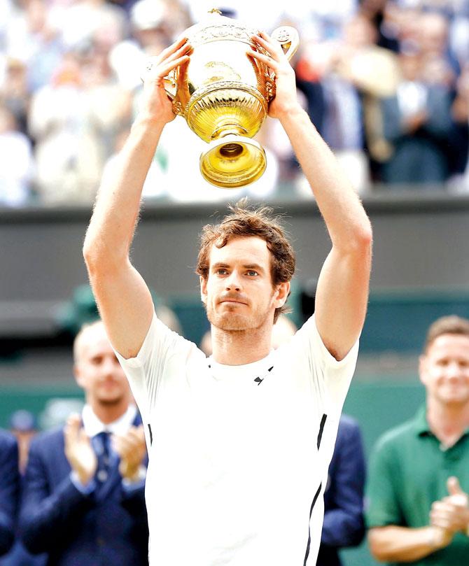 Andy Murray holds up the trophy after beating Milos Raonic 6-4, 7-6, 7-6 in the Wimbledon final on July 10. Pic/Getty Images