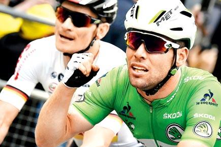 Tour de France: Mark Cavendish sets new mark with narrow win