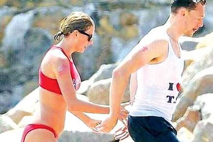 Taylor Swift strips down to bikini, gets cozy with Tom Hiddleston