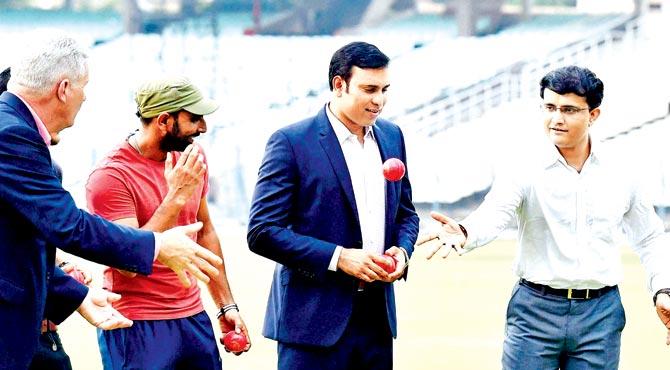 Former India skipper and Cricket Association of Bengal president Sourav Ganguly (right) throws a pink ball towards ex-Australia batsman Dean Jones (extreme left) as VVS Laxman and Mohammed Shami look on at Eden Gardens last month. Pic/PTI