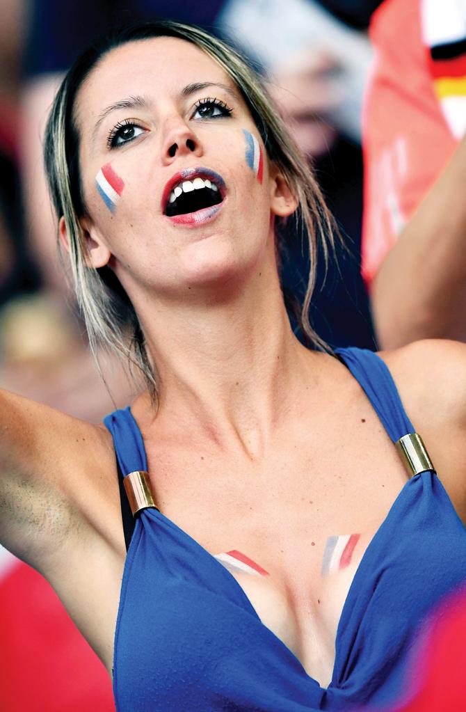 A female fan cheers for France at the Stade Velodrome, Marseille 