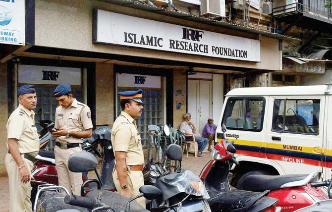 Police outside the Islamic Research Foundation office. File pic