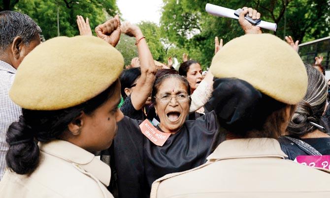 Activists demand the passing of the Women’s Reservation Bill in Delhi yesterday. Pic/PTI