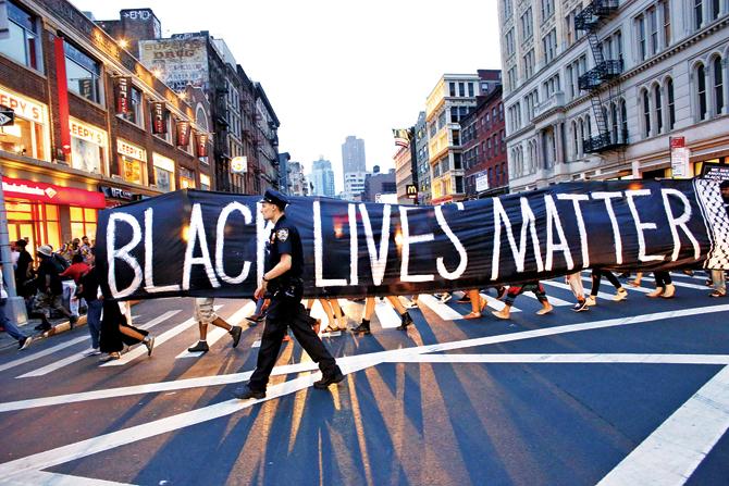 A cop patrols during a protest in support of the Black Lives Matter movement in New York yesterday. Pic/AFP