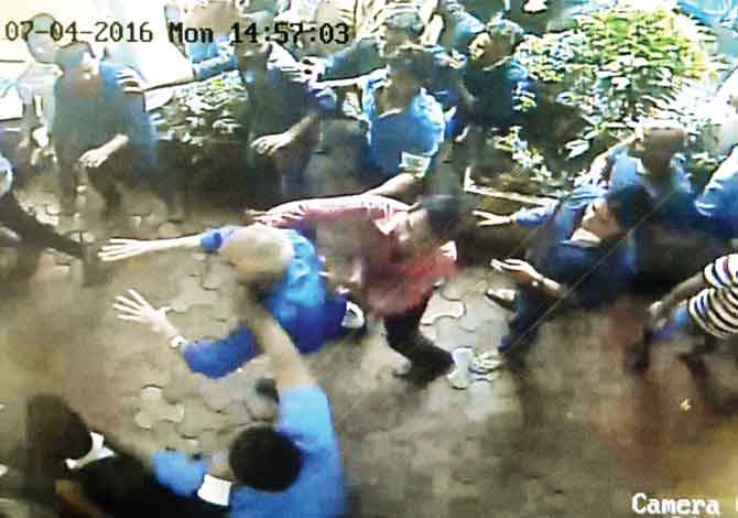 A CCTV grab of M K Vakharia (centre) in the midst of the melee