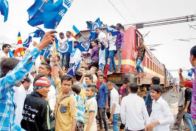 Members of Dalit community stop a train at Udhna Junction during a protest in Surat yesterday. Pic/PTI