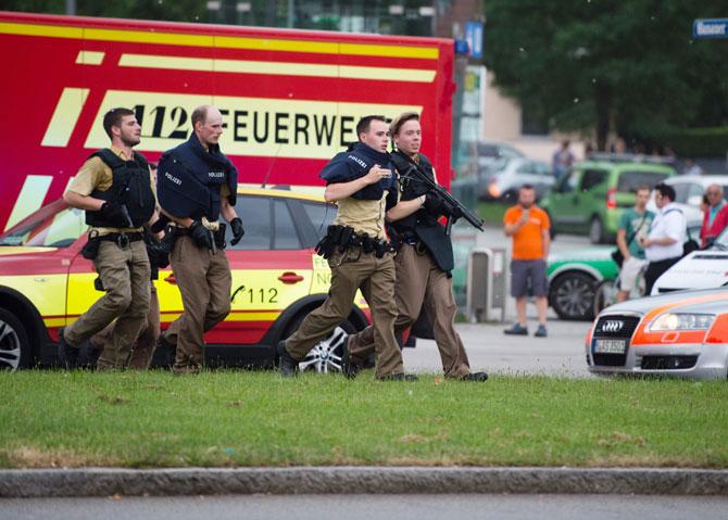 Police walks near a shopping mall amid a shooting on July 22, 2016 in Munich. Several people were killed on Friday in a shooting rampage by a lone gunman in a Munich shopping centre, media reports said