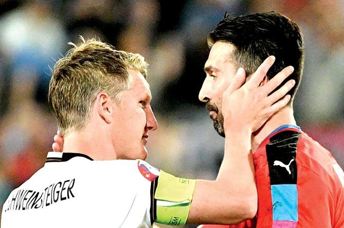 Italy-s goalkeeper Gianluigi Buffon R congratulates Germany-s midfielder Bastian Schweinsteiger after Germany won the match in nine penalty shoot-outs in the Euro 2016 quarter-final football match between Germany and Italy at the Matmut Atlantique stadium in Bordeaux. Pic/AFP