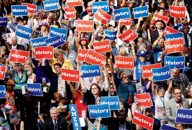 Herstory, she’s made it: Delegates at the convention cheer for their nominee Hillary Clinton. Pics/AFP