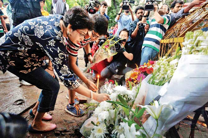 Two days after the attack on the Holey Artisan Bakery in Dhaka, Bangladesh, people pay tribute to the victims on Sunday. Pic/PTI