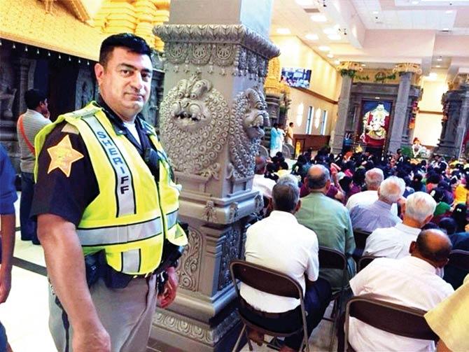 Javed Khan guards the largest Hindu temple in Indianapolis. Pic/PTI