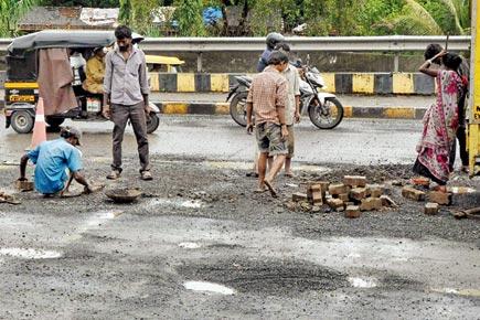 Mumbai: Potholes dot WEH, filled half-heartedly
