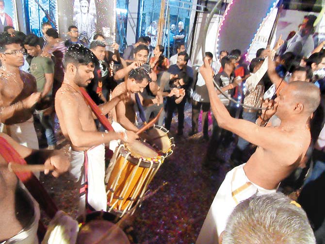 Musicians play the kombu and chenda drums at Rajinikanth