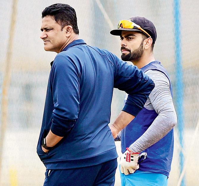 Test captain Virat Kohli with coach Anil Kumble during the preparatory camp at the National Cricket Academy in Bangalore yesterday. Pic/PTI