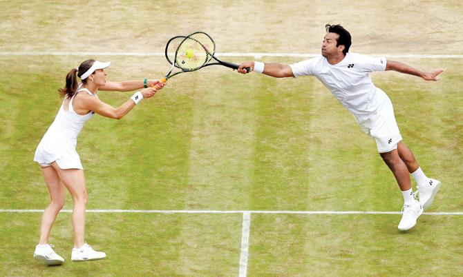 India’s Leander Paes and Martina Hingis of Switzerland go for the ball during their match against Henri Kontinen of Finland and Great Britain’s Heather Watson in London on Thursday. Pic/Getty Images