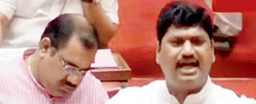 MLC Sandeep Bajoria (left) sleeps in the legislature while Dhananjay Munde tears into the government on the Kapordi issue