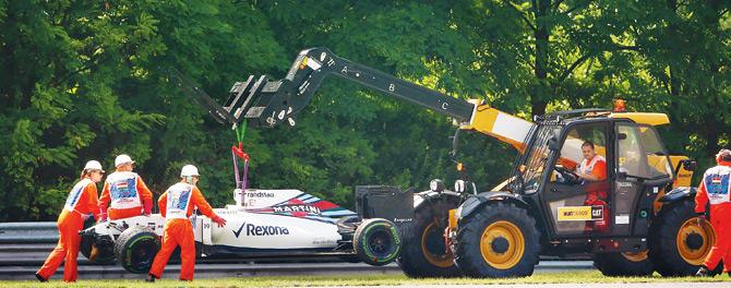 Brazilian Felipe Massa’s car is removed from the circuit during the Hungary GP qualifying in Budapest on Saturday. Pic/Getty Images