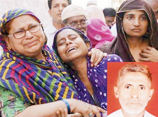 Family members of Mohammad Akhlaq mourn his death. file pic
