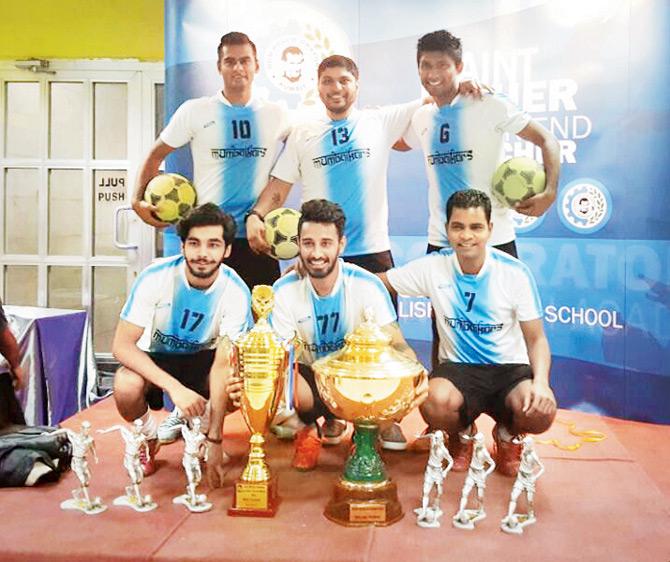 Mumbaikars with the winners trophy in Kuwait recently 