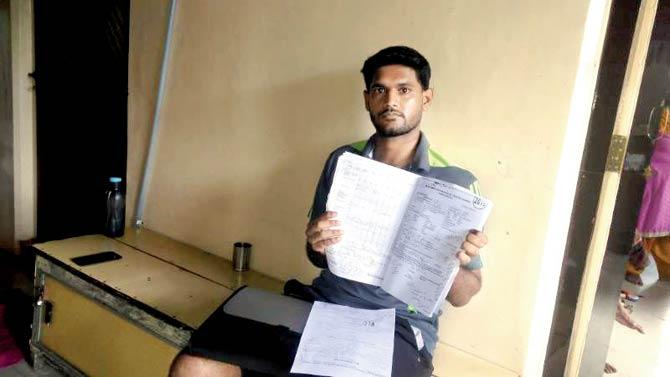 The victim’s son Pratik holds up the documents, which mention, “Patient fell down from table at OME of giving positioning at 3 am.”