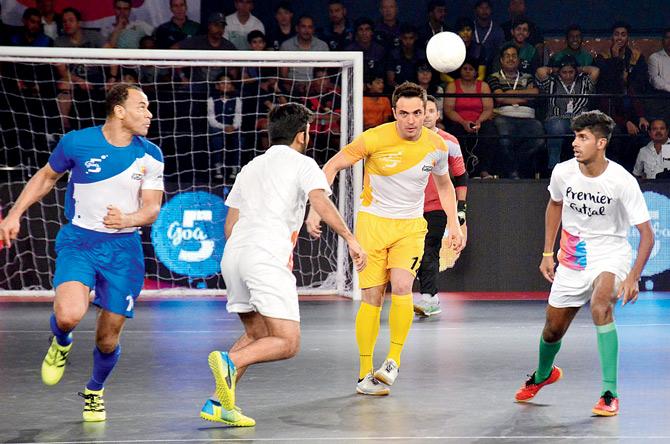 Players take part in a Legends match before the final of the Premier Futsal League in Mapusa, Goa yesterday. Pic/AFP