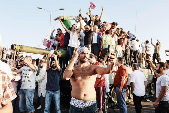 Civilians celebrate after rebel soldiers’ surrender