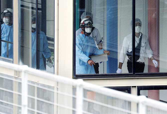 Rescue workers at the Tsukui Yamayuri En care centre in Japan.