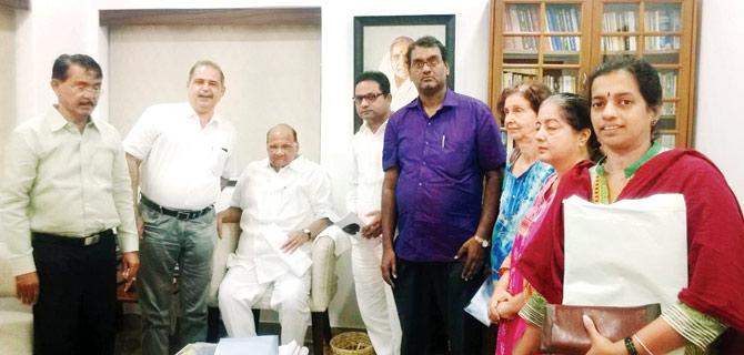 Sharad Pawar with MbPT tenants at his bungalow on Saturday when he heard their problems and then organised for their meet with Nitin Gadkari