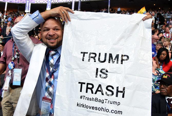 A delegate holds up sign against Donald Trump during day three of the Democratic National Convention at the Wells Fargo Center in Philadelphia.Pic/AFP