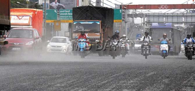 Dust from crushed stones fills the air on the WEH stretch between Bandra and Dahisar. Pic/Nimesh Dave
