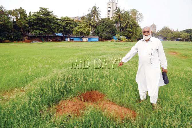 Curator Zulfikar Ahmed Shaikh points to the holes dug at Azad Maidan to mark the area for the forthcoming Metro III project. Pic/Suresh Karkera