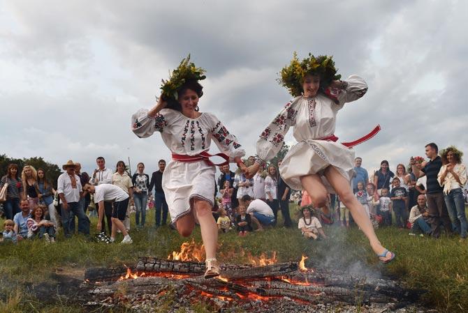 Revellers participate in the Ivana Kupala night, an ancient heathen holiday, in the Pyrogove village near Kiev, Ukraine