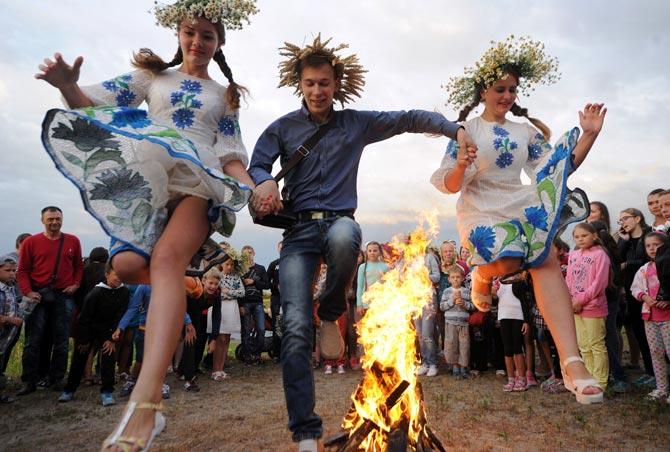 Revellers participate in the Ivana Kupala night, an ancient heathen holiday, in the Pyrogove village near Kiev, Ukraine