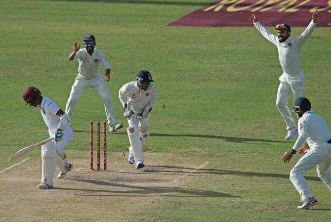 India celebrates while West Indies cricketer Kraigg Brathwaite