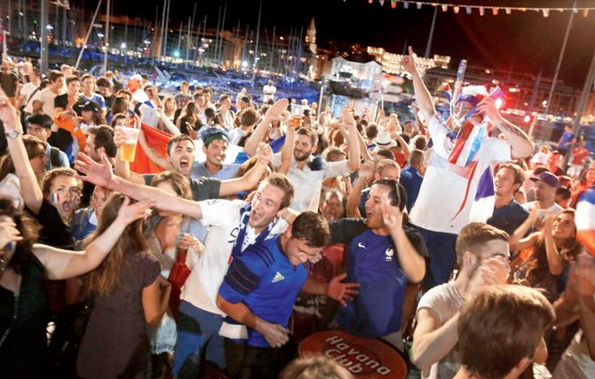 French fans takes to the streets in Marseille after their team stormed into the final Euro 2016 beating Germany 2-0 on Thursday. pics/afp 