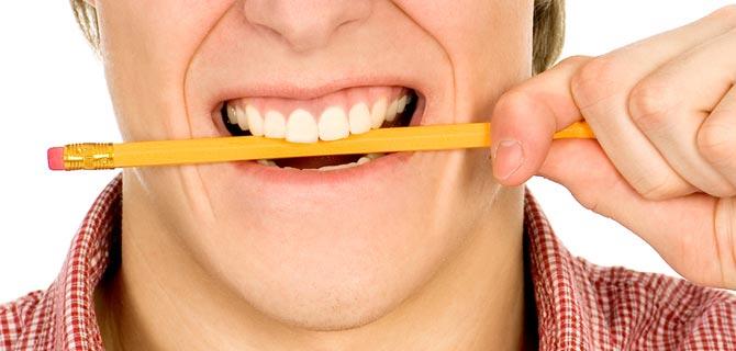 Hold a pencil between your teeth to cure headache