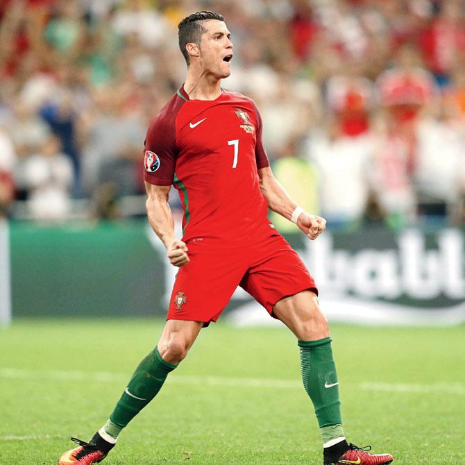 Portugal’s Cristiano Ronaldo exults after scoring against Poland in the tie-breaker. Pic/AFP