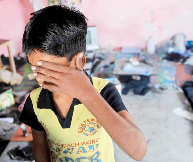 An Indian bonded child labourer crying during a raid and rescue operation conducted in New Delhi. File pic/AFP