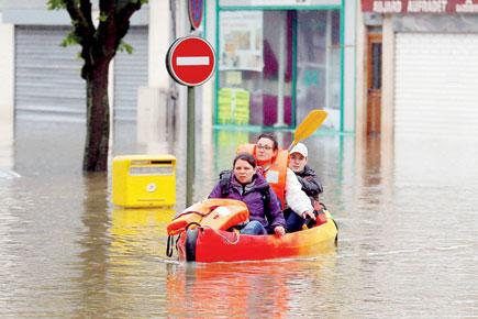 Residents row to safety after rains lash France