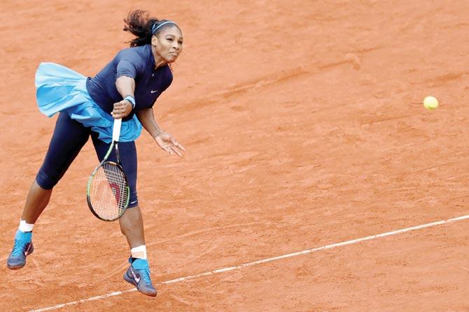 Serena Williams serves during her French Open semi-final against Kiki Bertens  yesterday. Pics/GETTY IMAGES, AFP