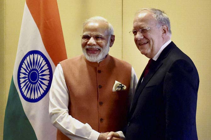 Prime Minister Narendra Modi shakes hands Switzerland’s President Johann Schneider-Ammann. Pic/ PTI